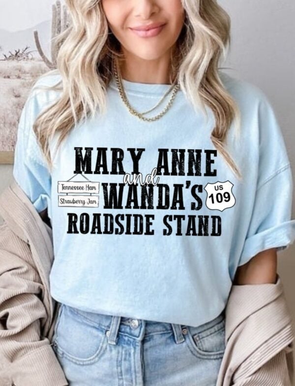 Chambray Comfort Colors unisex graphic t-shirt with vintage-style ‘Mary Anne & Wanda’s Roadside Stand’ white retro text, strawberry jam jar and country stand illustration — southern small-town farm market tee, cottagecore aesthetic shirt, Nashville country music merch, women’s country graphic tee, southern road trip souvenir shirt, soft vintage cotton tee for summe